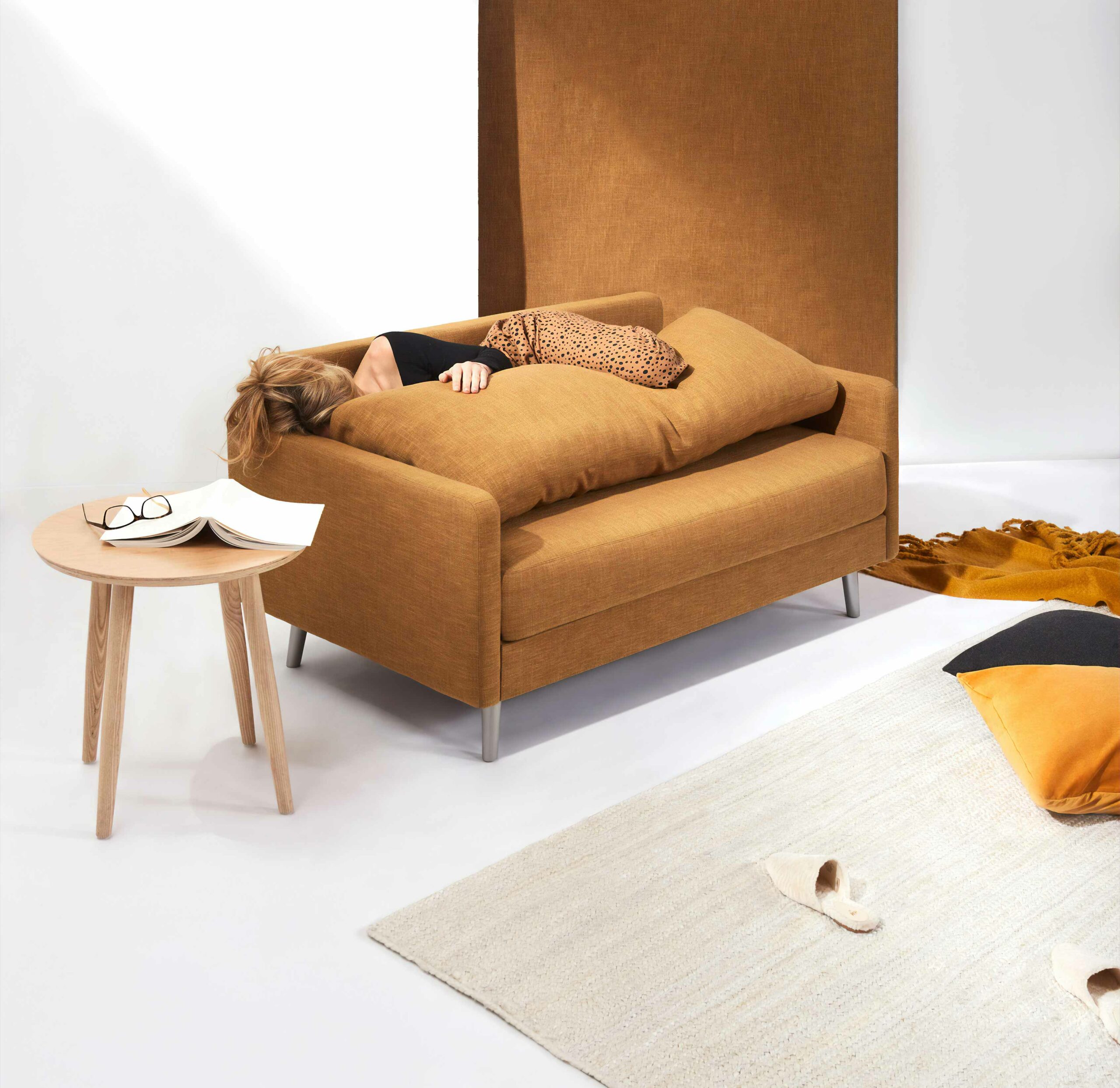 Woman Laying on Brown Sofa 1 Woman Laying on Brown Sofa 1